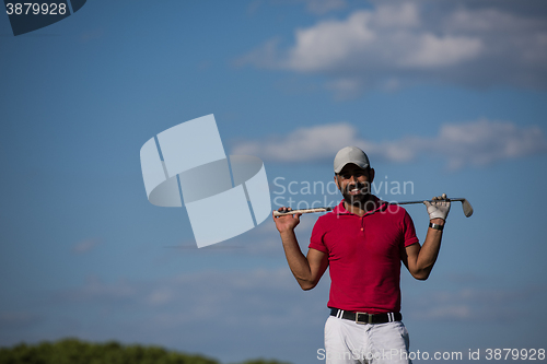 Image of handsome middle eastern golf player portrait at course