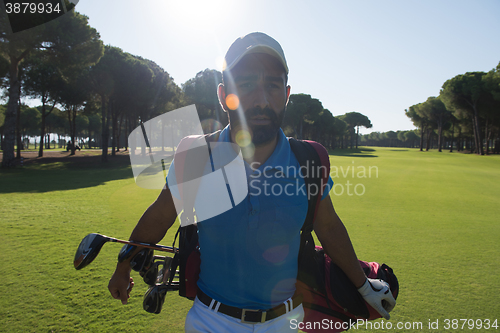 Image of golf player walking