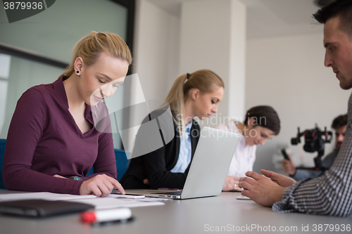 Image of young business people group on team meeting at modern office