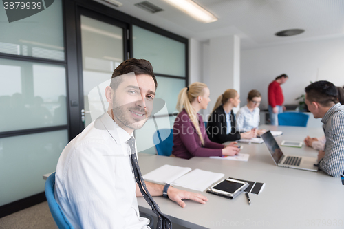 Image of young business people group on team meeting at modern office