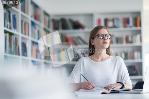 Image of female student study in school library
