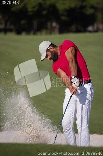 Image of golfer hitting a sand bunker shot