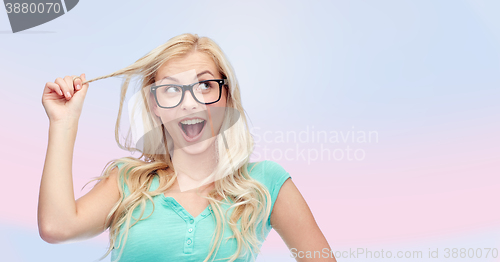 Image of happy young woman or teenage girl in glasses