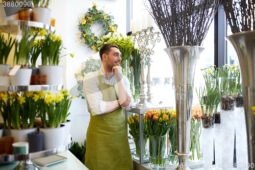 Image of florist man or seller at flower shop