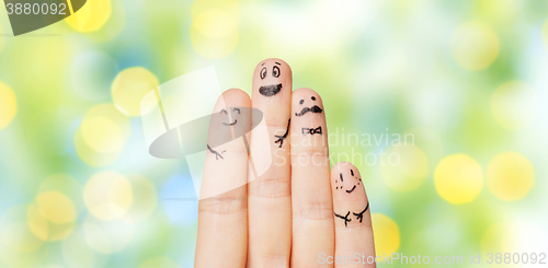 Image of close up of hands and fingers with smiley faces