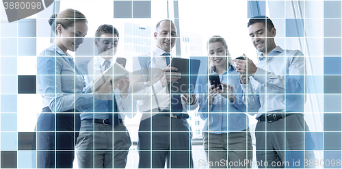 Image of business people with tablet pc and smartphones