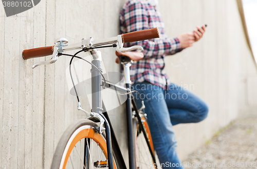 Image of close up of hipster fixed gear bike and man