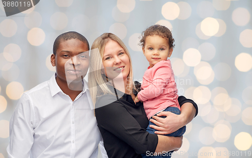 Image of happy multiracial family with little child