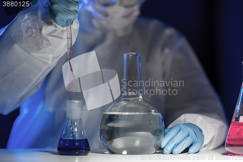 Image of close up of scientist making test in lab