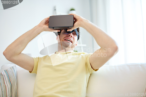 Image of young man in virtual reality headset or 3d glasses