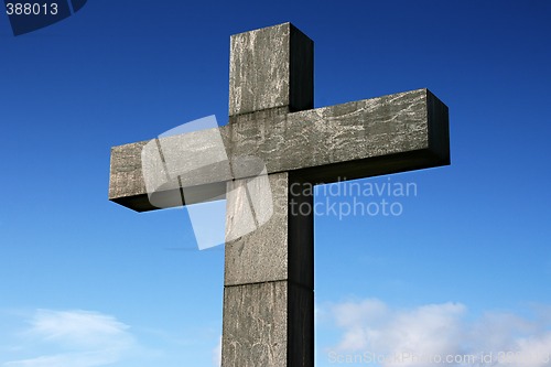 Image of Stone cross under a blue sky