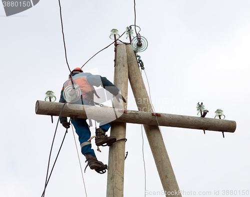 Image of electrician working on the power lines after the accident