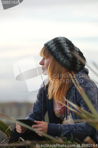 Image of Woman Reading Outdoors