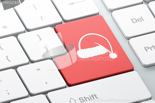 Image of Holiday concept: Christmas Hat on computer keyboard background