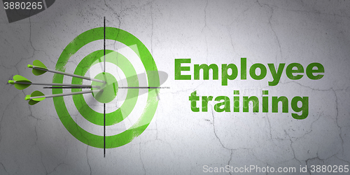 Image of Education concept: target and Employee Training on wall background