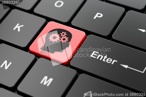 Image of Learning concept: Head With Gears on computer keyboard background