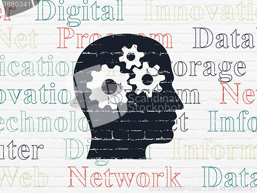 Image of Data concept: Head With Gears on wall background