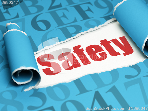 Image of Safety concept: red text Safety under the piece of  torn paper