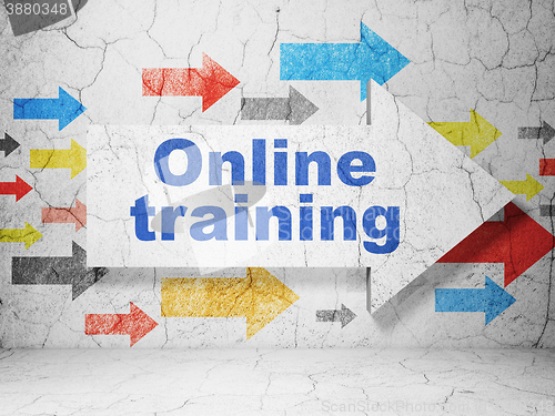 Image of Learning concept: arrow with Online Training on grunge wall background