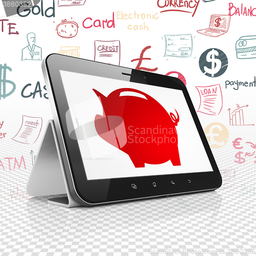 Image of Banking concept: Tablet Computer with Money Box on display