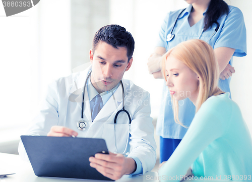 Image of male doctor with patient