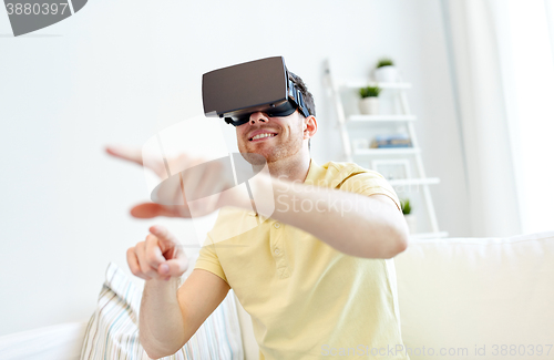 Image of young man in virtual reality headset or 3d glasses