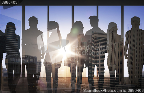 Image of people silhouettes over city airport background