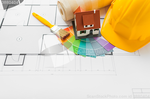 Image of close up of house blueprint with building tools