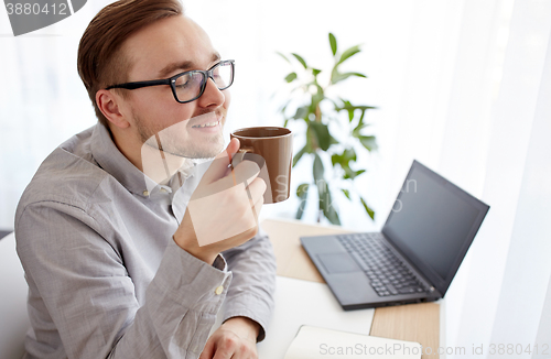 Image of creative man or businessman drinking coffee