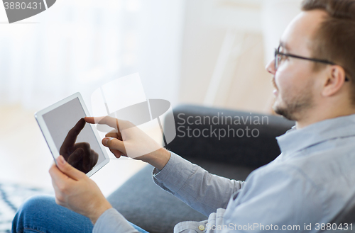 Image of man with tablet pc at home