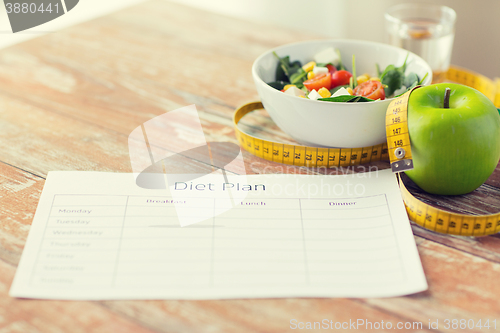 Image of close up of diet plan and food on table