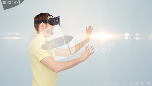 Image of happy man in virtual reality headset or 3d glasses