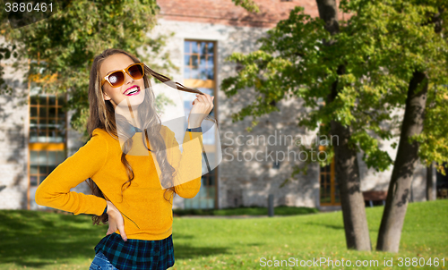 Image of happy young woman or teen girl in casual clothes