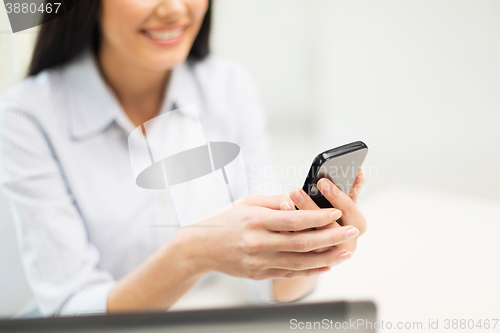 Image of close up of woman texting on smartphone