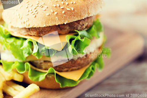 Image of close up of hamburger or cheeseburger on table