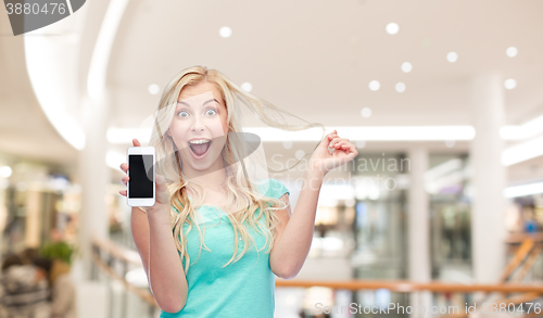 Image of happy young woman or teenage girl with smartphone