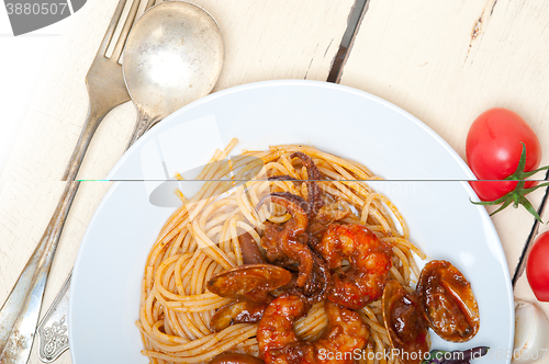 Image of Italian seafood spaghetti pasta on red tomato sauce 