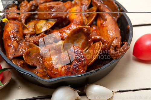 Image of fresh seafoos stew on an iron skillet