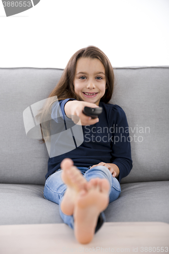 Image of Girl holding a TV remote