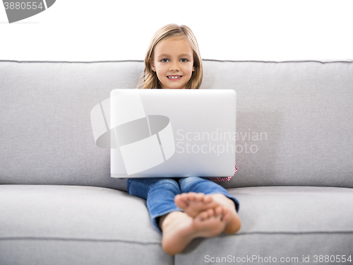 Image of Little girl working with a laptop