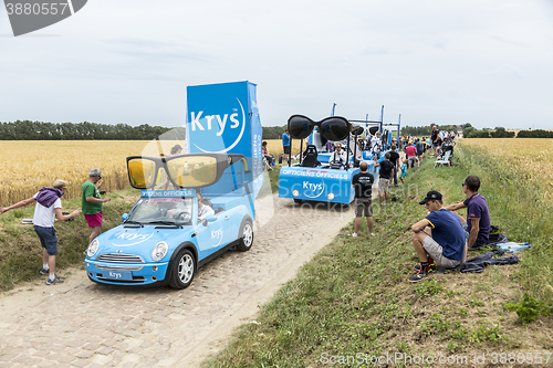 Image of Krys Caravan on a Cobblestone Road- Tour de France 2015