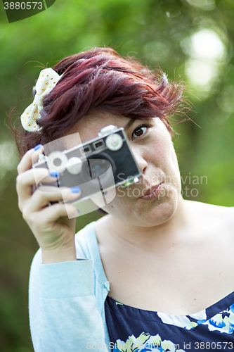 Image of Woman Snapping a Photo