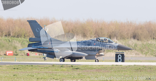 Image of LEEUWARDEN, NETHERLANDS - APRIL 11, 2016: A dutch F-16 on the gr