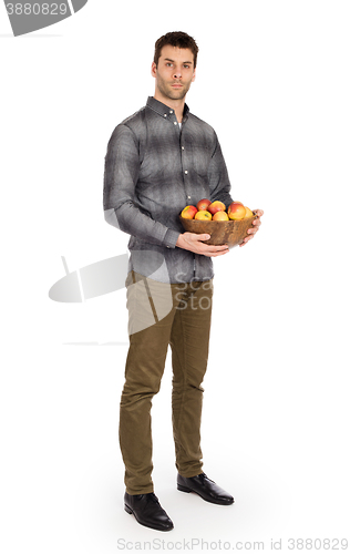 Image of Healthy man with bowl full of apples
