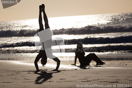 Image of Happy couple having fun on beach.