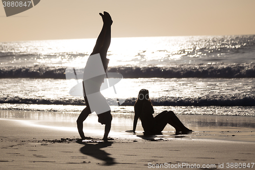 Image of Happy couple having fun on beach.