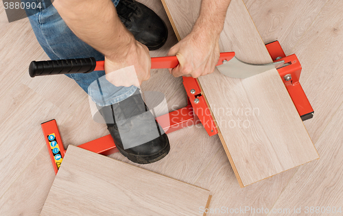 Image of Red tool for cutting laminate