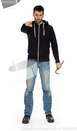 Image of Crime concept. Criminal in hood with crowbar in hand