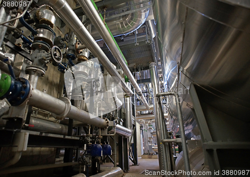 Image of Equipment, cables and piping as found inside of a modern industr