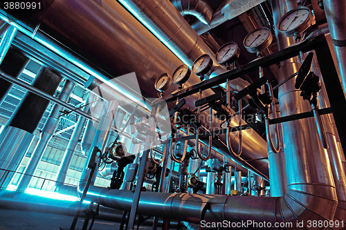 Image of Equipment, cables and piping as found inside of a modern industrial power plant